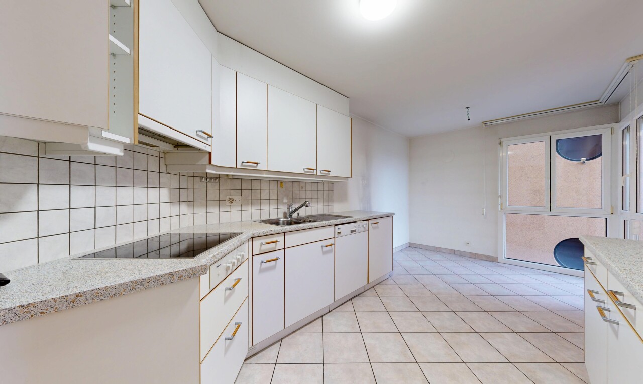kitchen with white cabinets, white dishwasher, light tile patterned floors, backsplash, and black electric cooktop