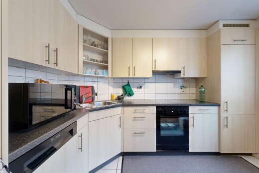 küche mit arbeitsplatten, mikrowelle, offene regale, ofen, und inside property