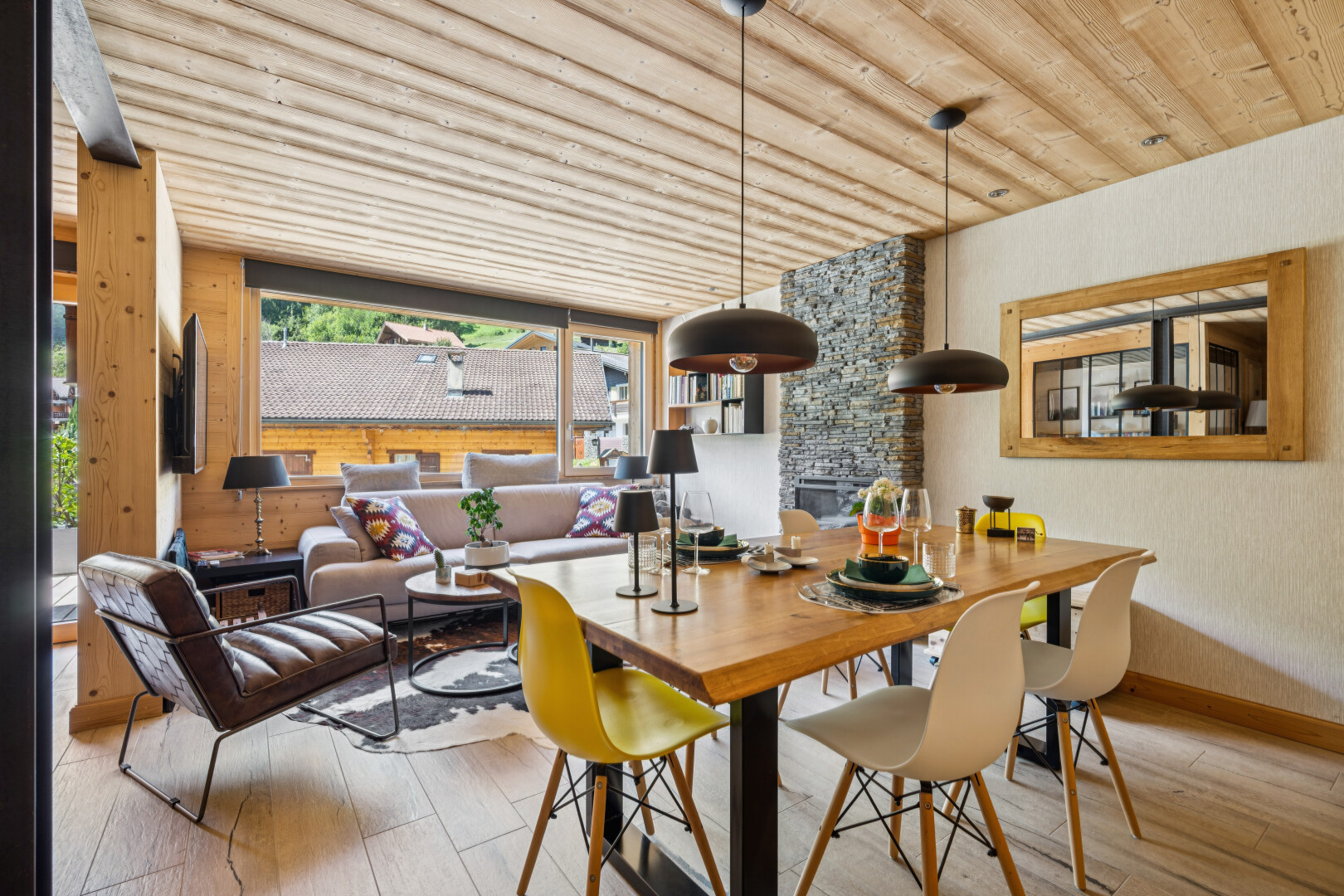 living area with wood ceiling, pendant lighting, and light wood-type flooring