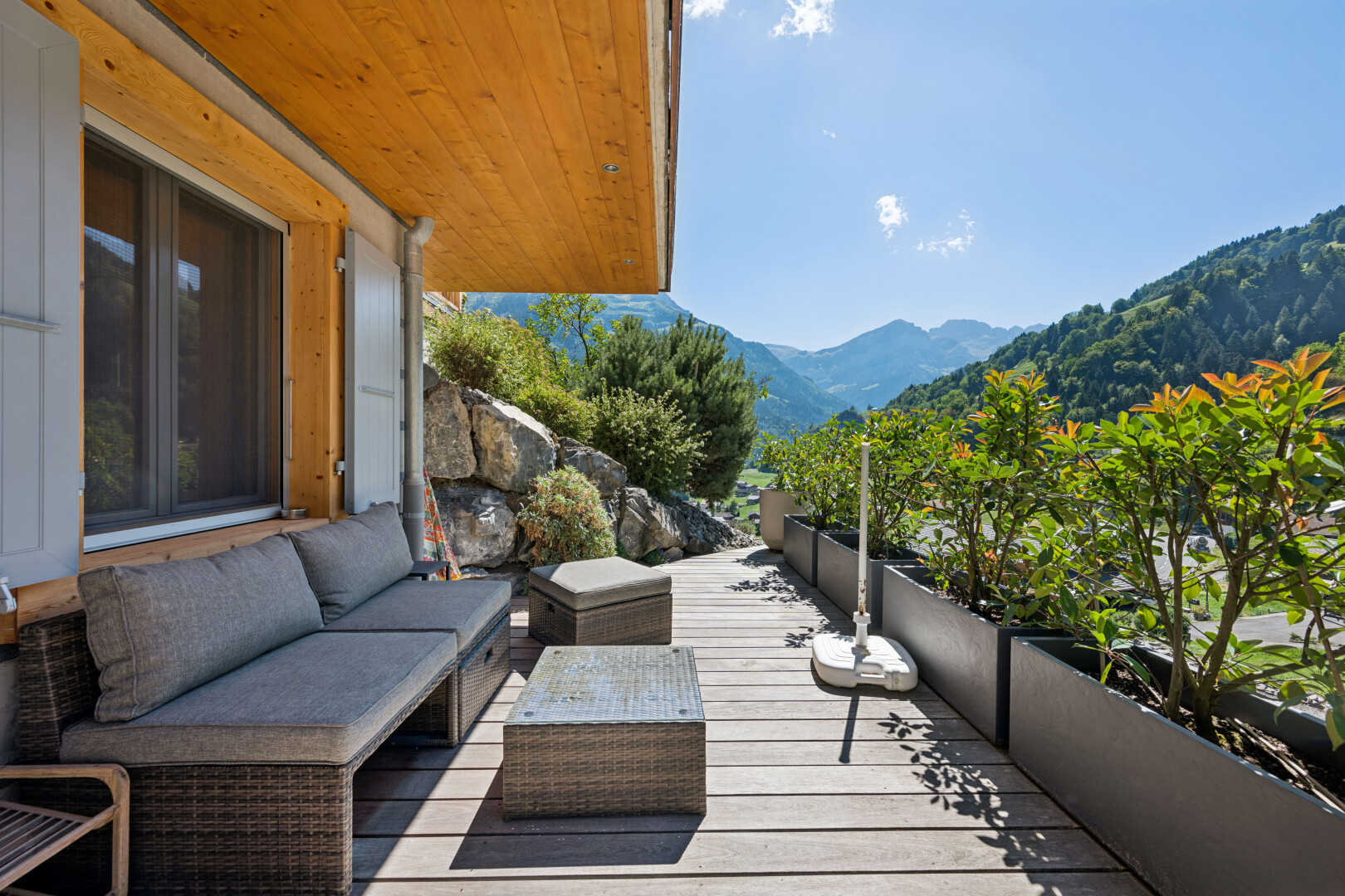 balcony featuring a deck with mountain view and an outdoor living space