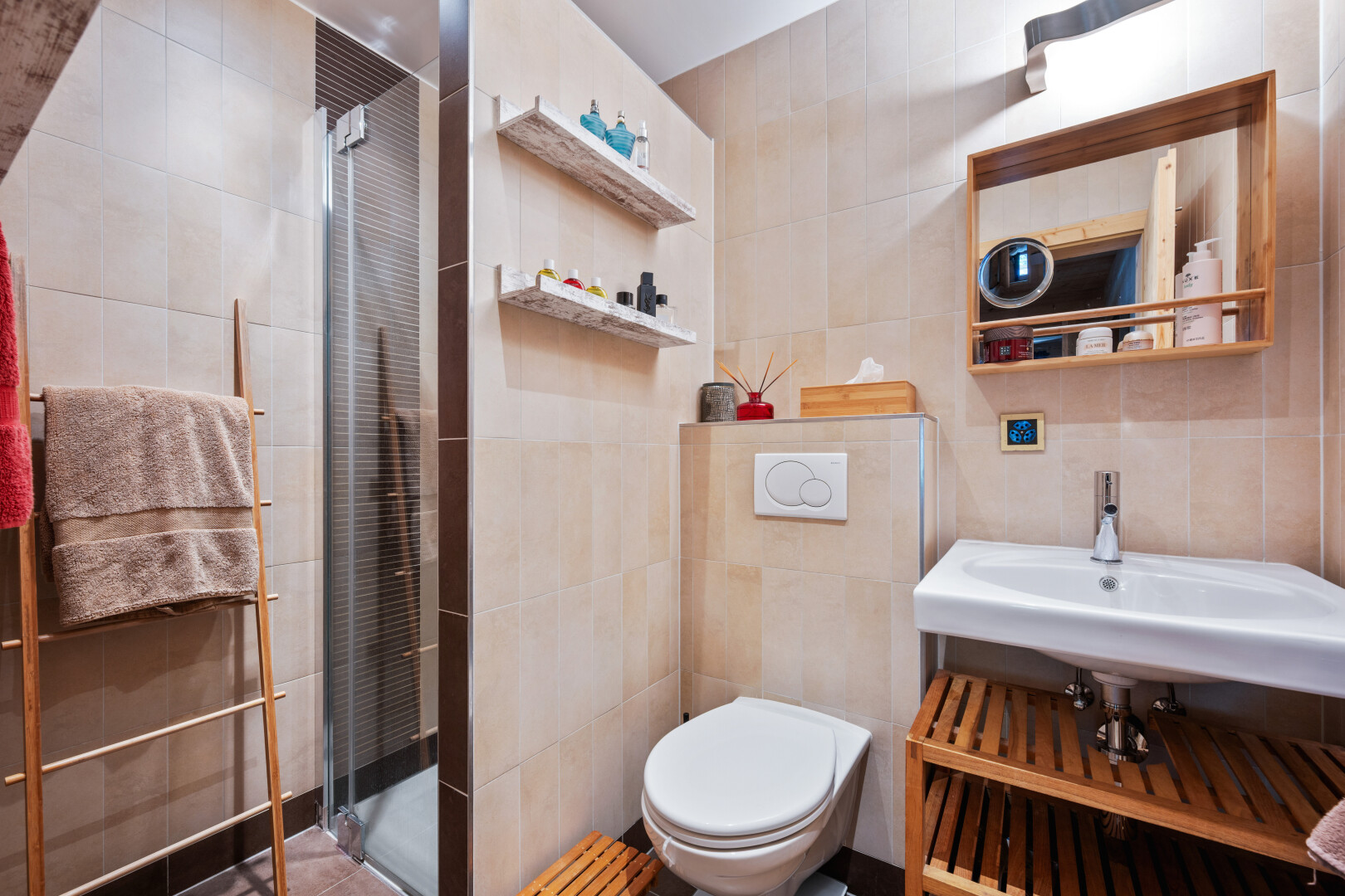 full bathroom featuring tile walls and a stall shower