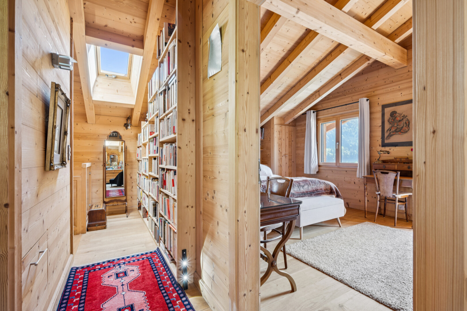 hall with lofted ceiling with beams, light wood-type flooring, and wood walls