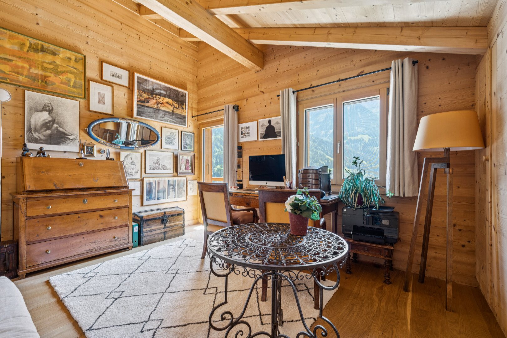 living area featuring lofted ceiling with beams, wood finished floors, wooden walls, and wooden ceiling