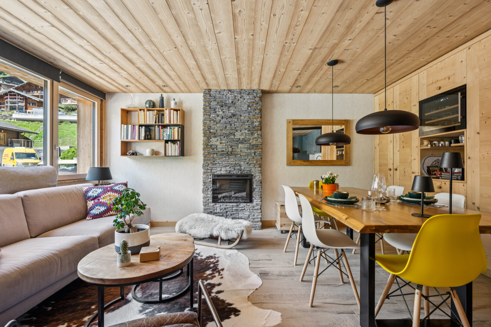living room with a fireplace, wood ceiling, decorative light fixtures, and built in shelves