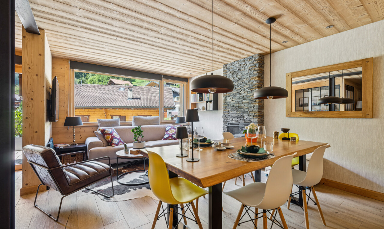 living area with wood ceiling, pendant lighting, and light wood-type flooring