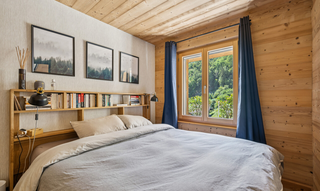 room featuring wood ceiling and wooden walls