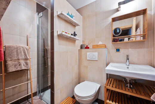 full bathroom featuring tile walls and a stall shower