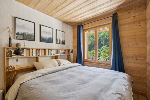 room featuring wood ceiling and wooden walls