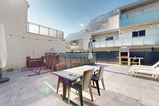 patio / terrace with a patio, outdoor dining space, and a mountain view