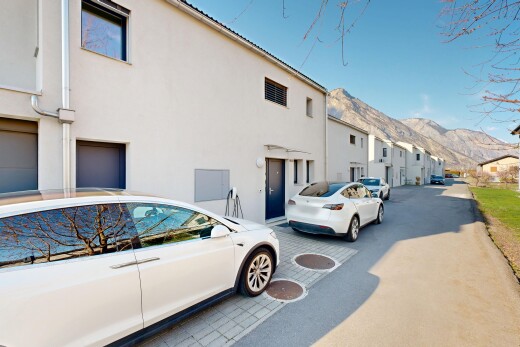 outdoor house with a mountain view, stucco siding, and a residential view