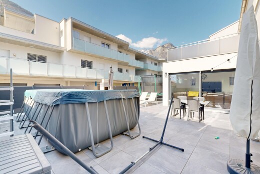 view of building exterior featuring a covered pool