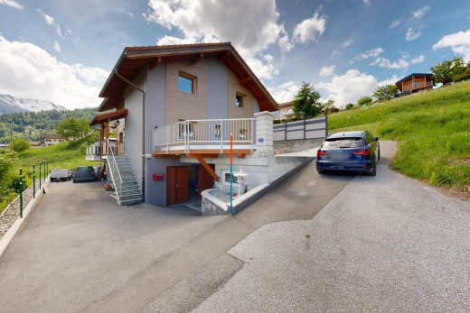 view of property featuring a deck and stucco siding