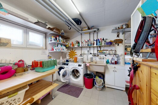 laundry area with washing machine and dryer and cabinet space