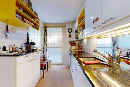 küche mit offene regale, weiße schränke, carpet, teppich, und inside property