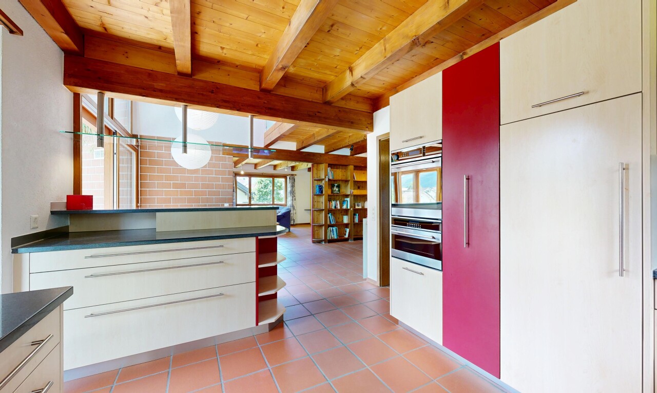 küche mit dark countertops, arbeitsplatten, light floor, two heights countertops, und natural light