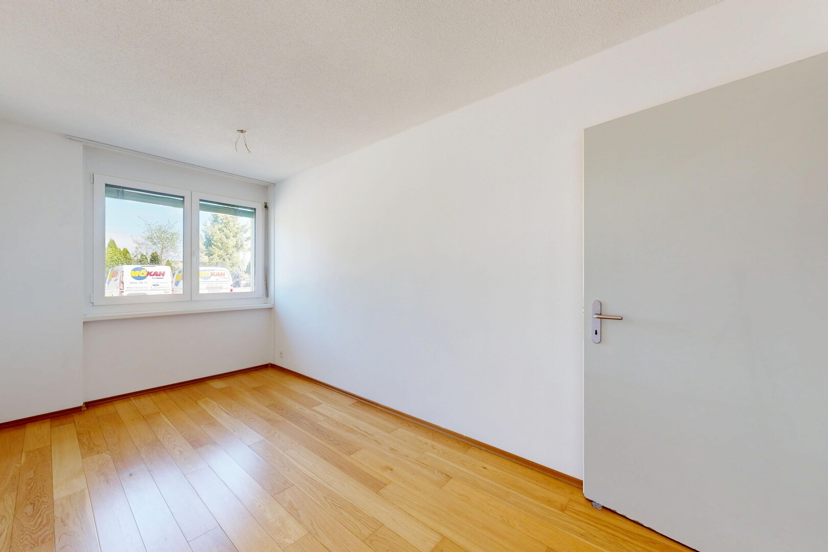 unfurnished room with light wood-style floors