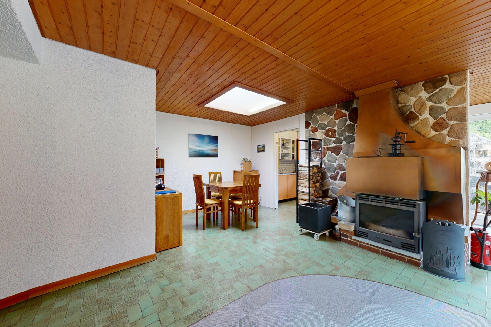 living / dining room with wood ceiling