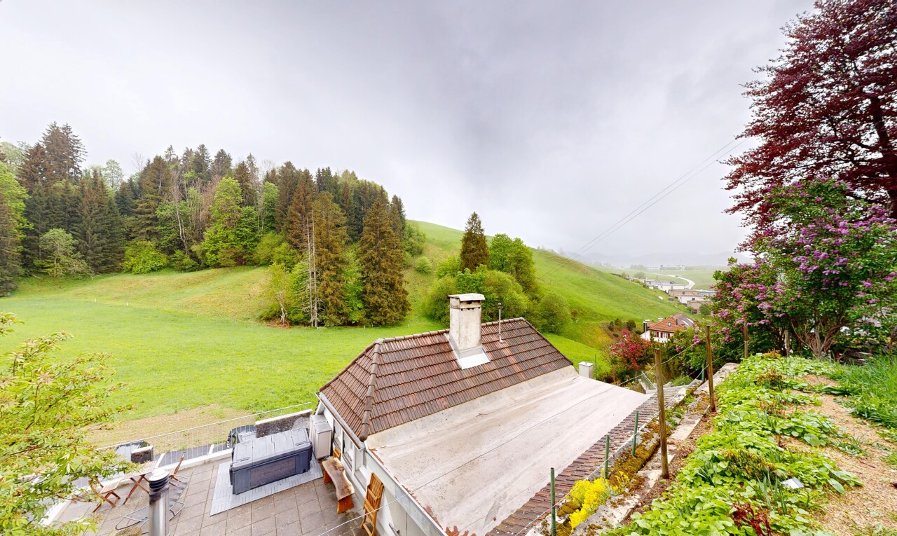 view of property with a chimney and a yard