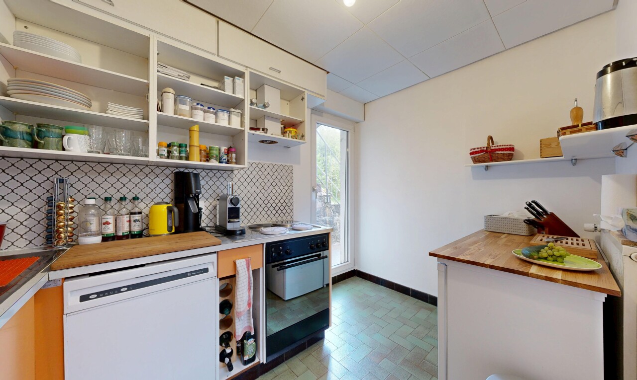 kitchen with open shelves, wood counters, dishwasher, oven, and backsplash