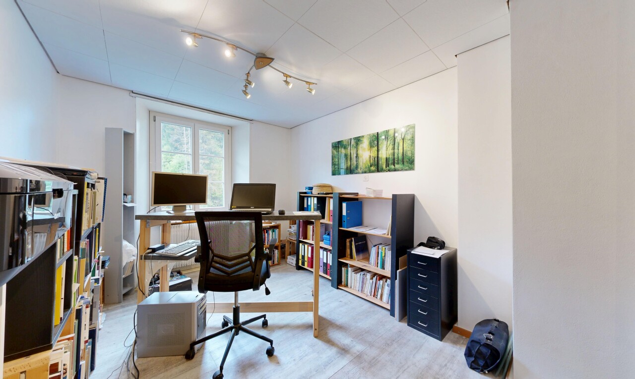 home office featuring track lighting and light wood-style floors