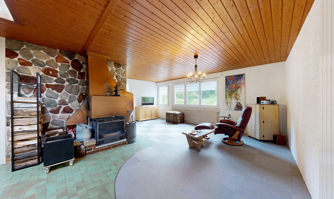 living room with hanging lights, wood ceiling, and light floors