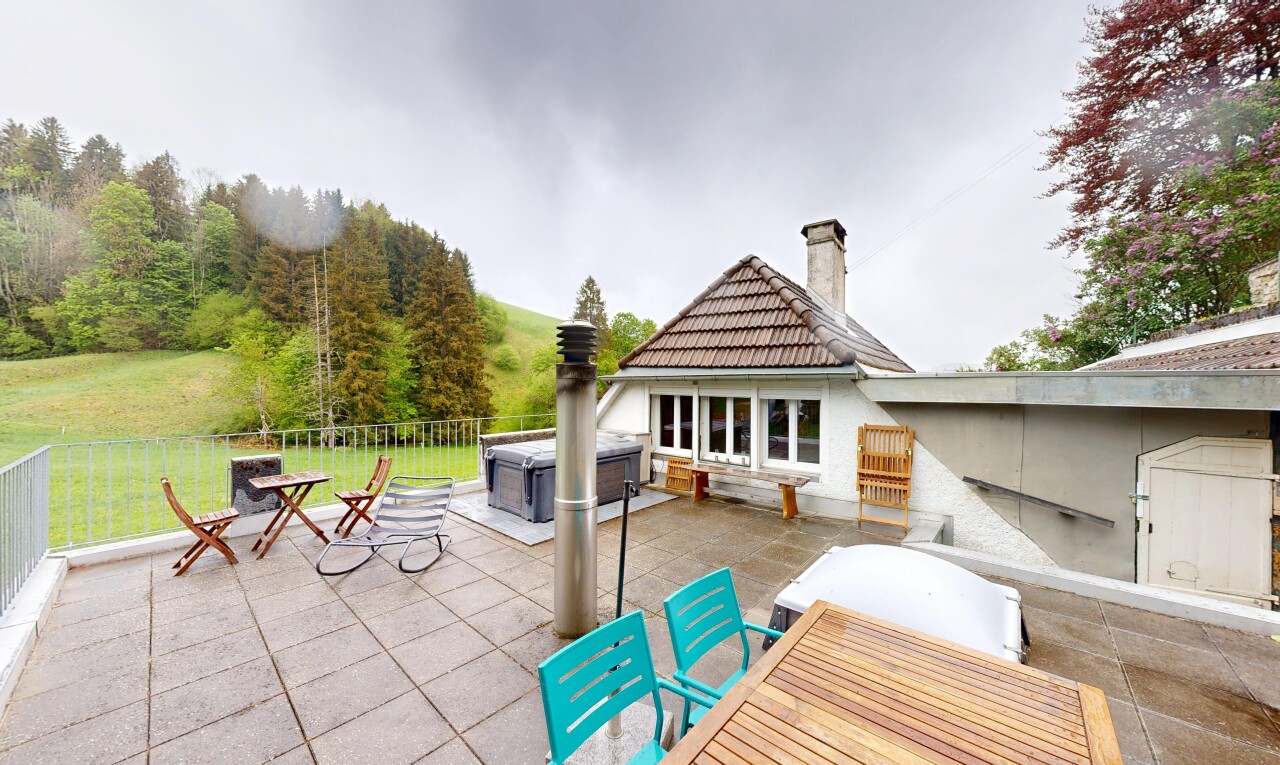 patio / terrace with a patio area, a hot tub, and outdoor dining space
