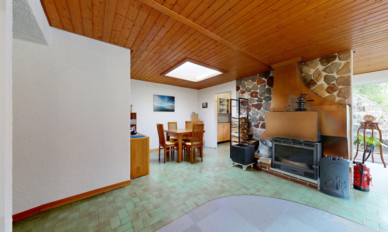 living / dining room with wood ceiling