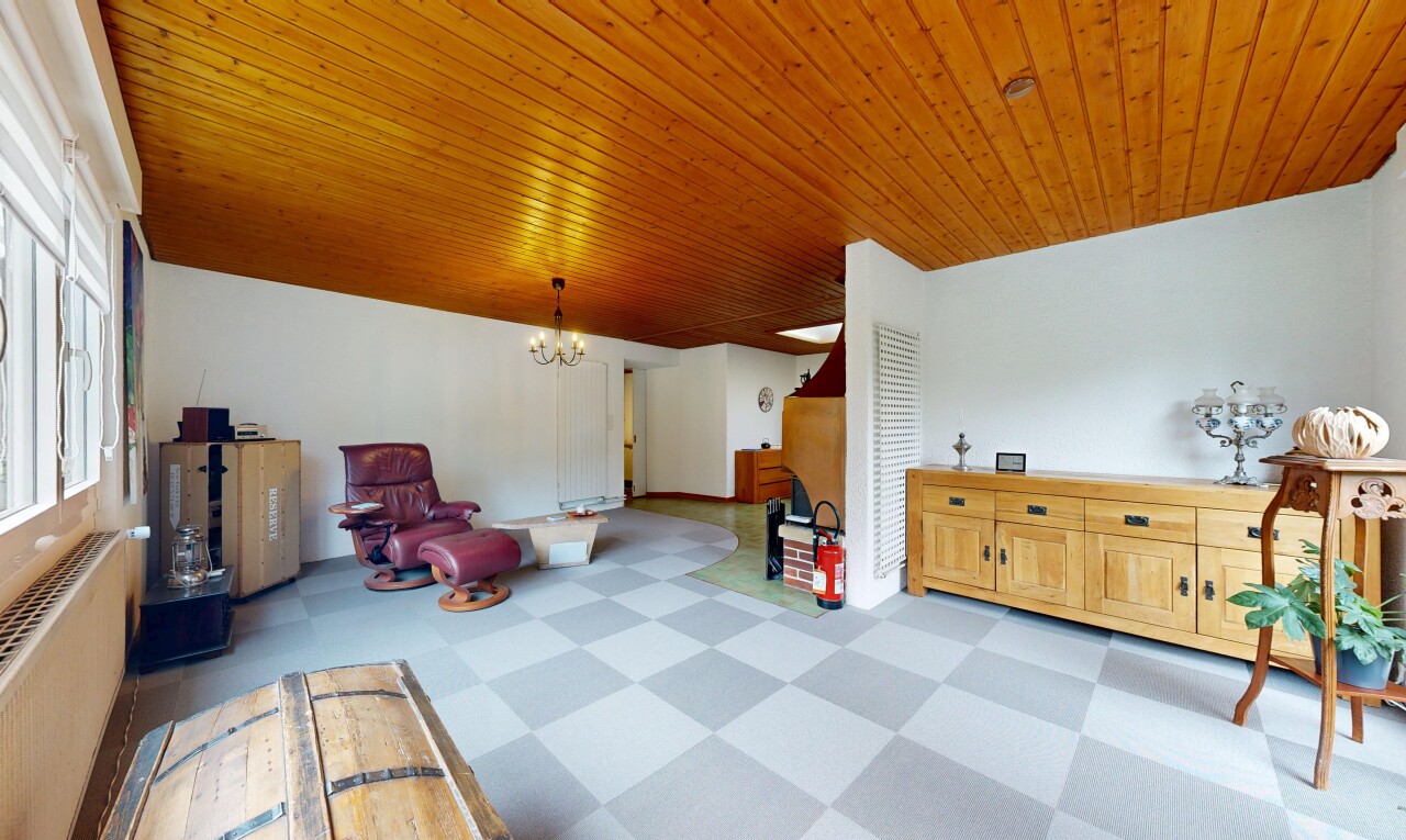 living area featuring a chandelier, light floors, and wooden ceiling