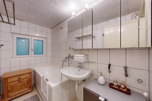 full bathroom with tile walls, tasteful backsplash, and shower / bathtub combination