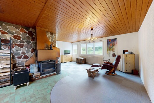 living room with hanging lights, wood ceiling, and light floors