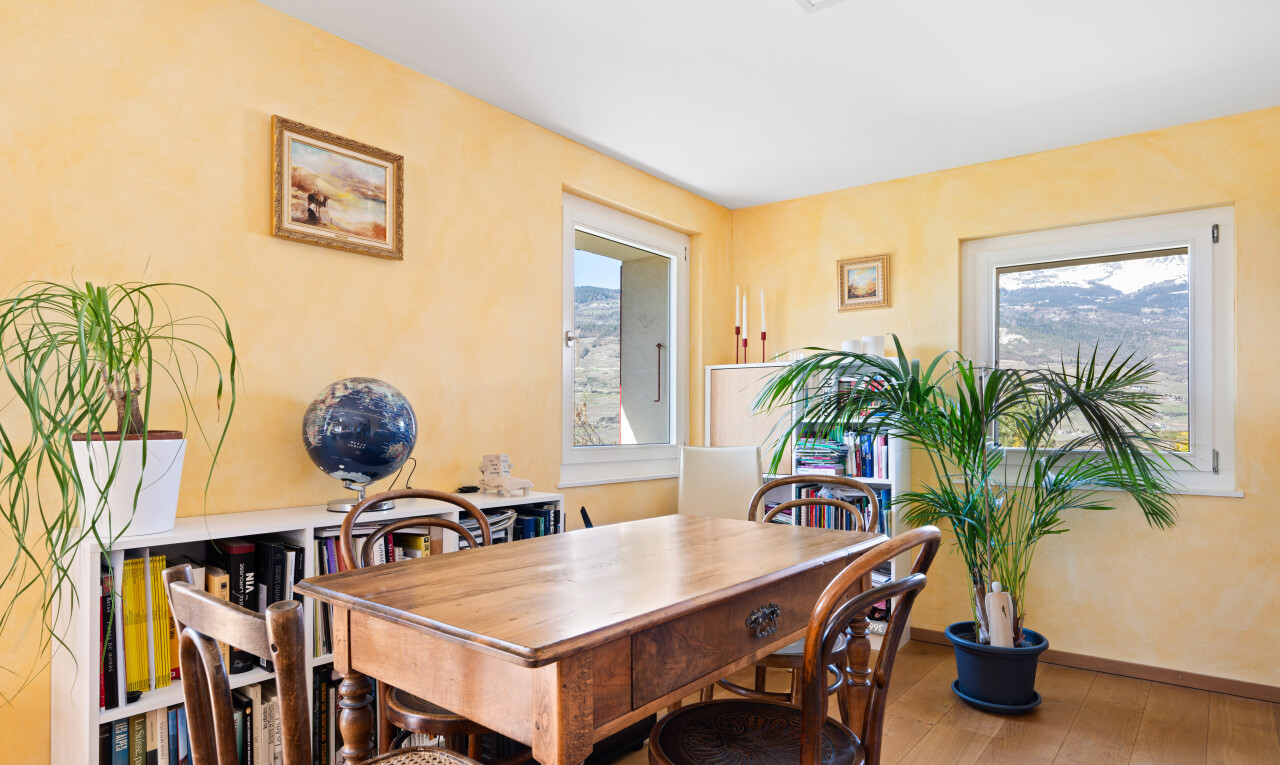dining space featuring light wood-style flooring and baseboards