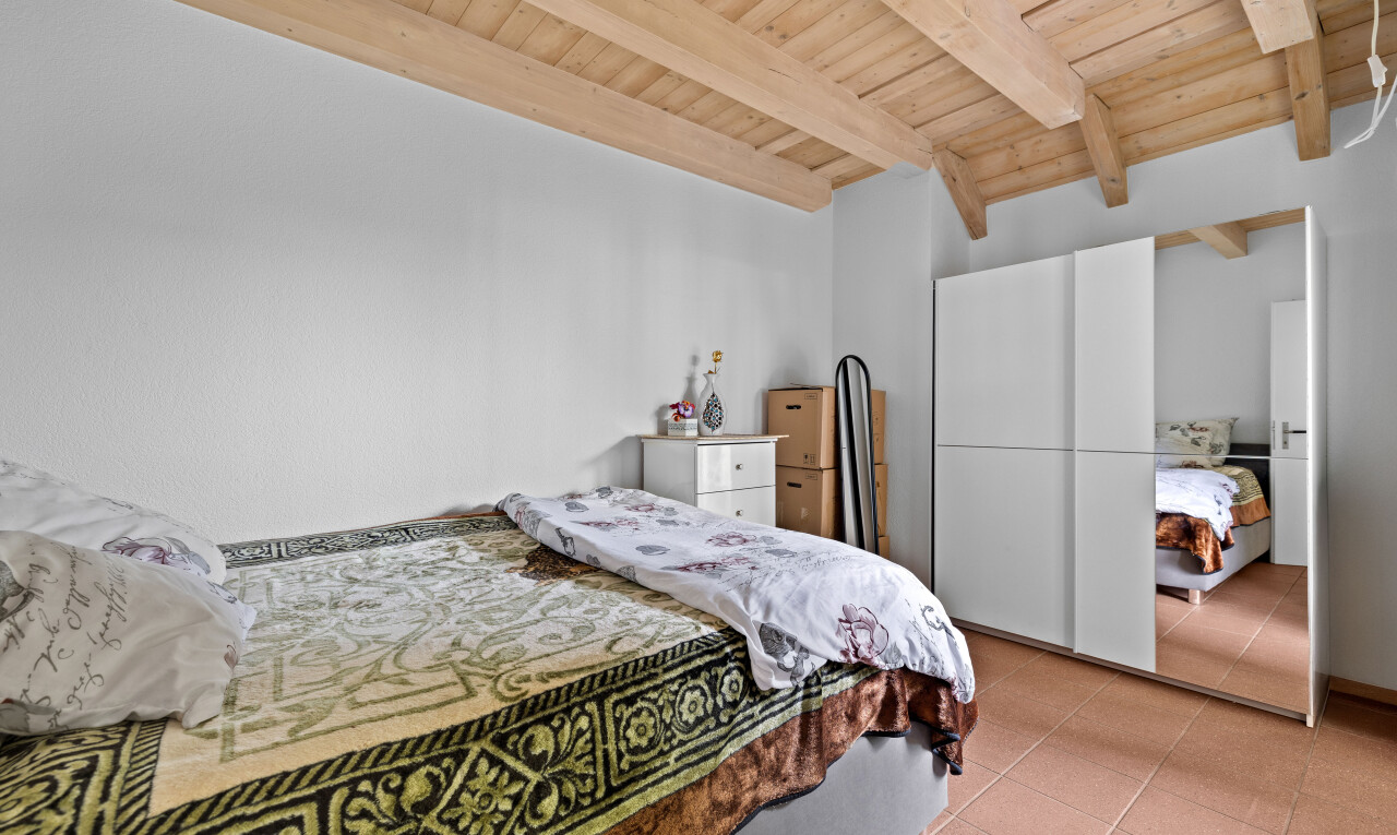 tiled room featuring a wood ceiling with exposed beams