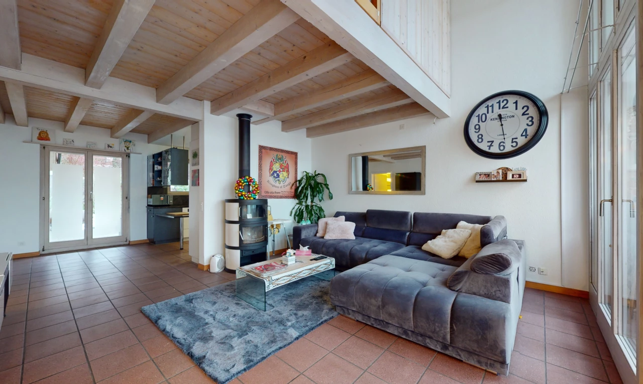 tiled living room featuring a wood stove, beam ceiling, and wood ceiling