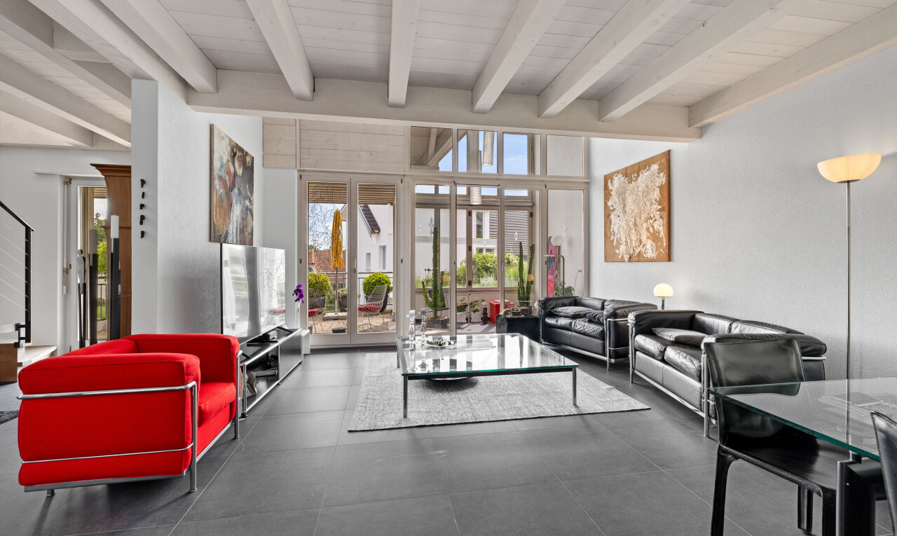 wohn- / esszimmer mit fernseher, beamed ceiling, balkendecke, französische türen, und natural light