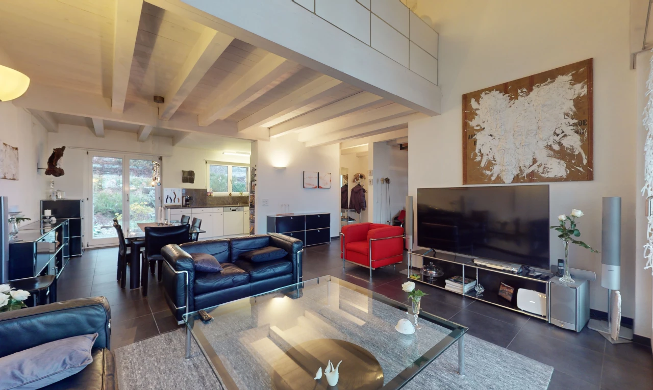 tiled living / dining room with beam ceiling