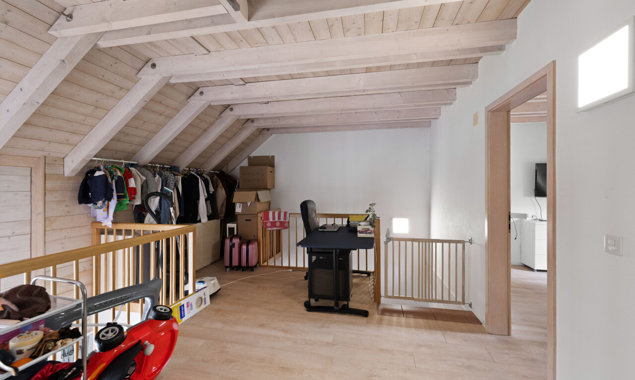 room with wood finished floors and wooden ceiling
