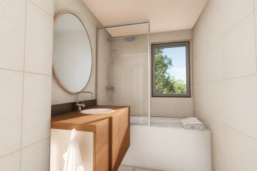 salle de bain avec miroir, mur carrelé, lumière naturelle, meuble-lavabo, et vasque