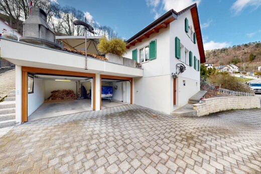 außenansicht mit auffahrt, day time, stuckverkleidung, und property visible