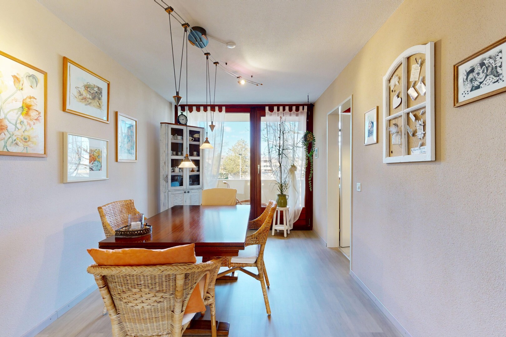 dining space with light wood-style flooring and baseboards