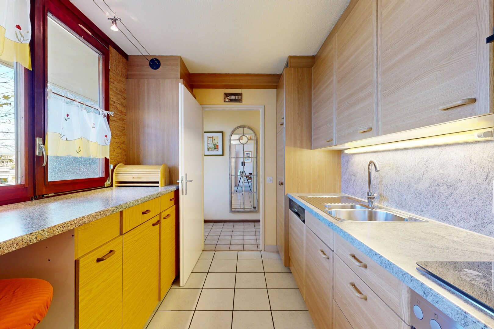 kitchen featuring light tile patterned floors, black electric stovetop, light stone countertops, and oven