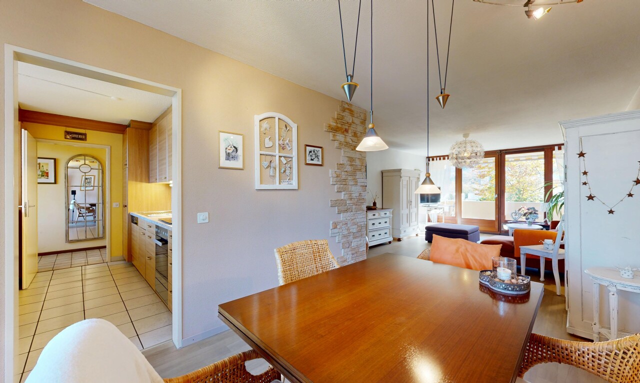 dining space with light tile patterned floors and baseboards