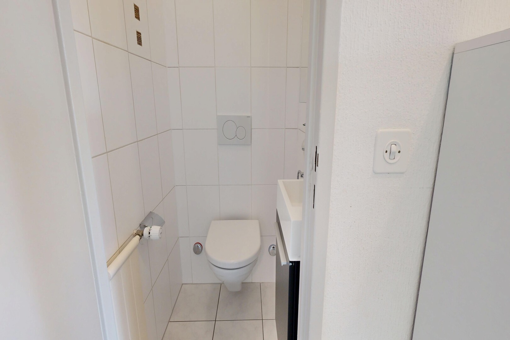 bathroom with vanity, tile walls, and light tile patterned floors