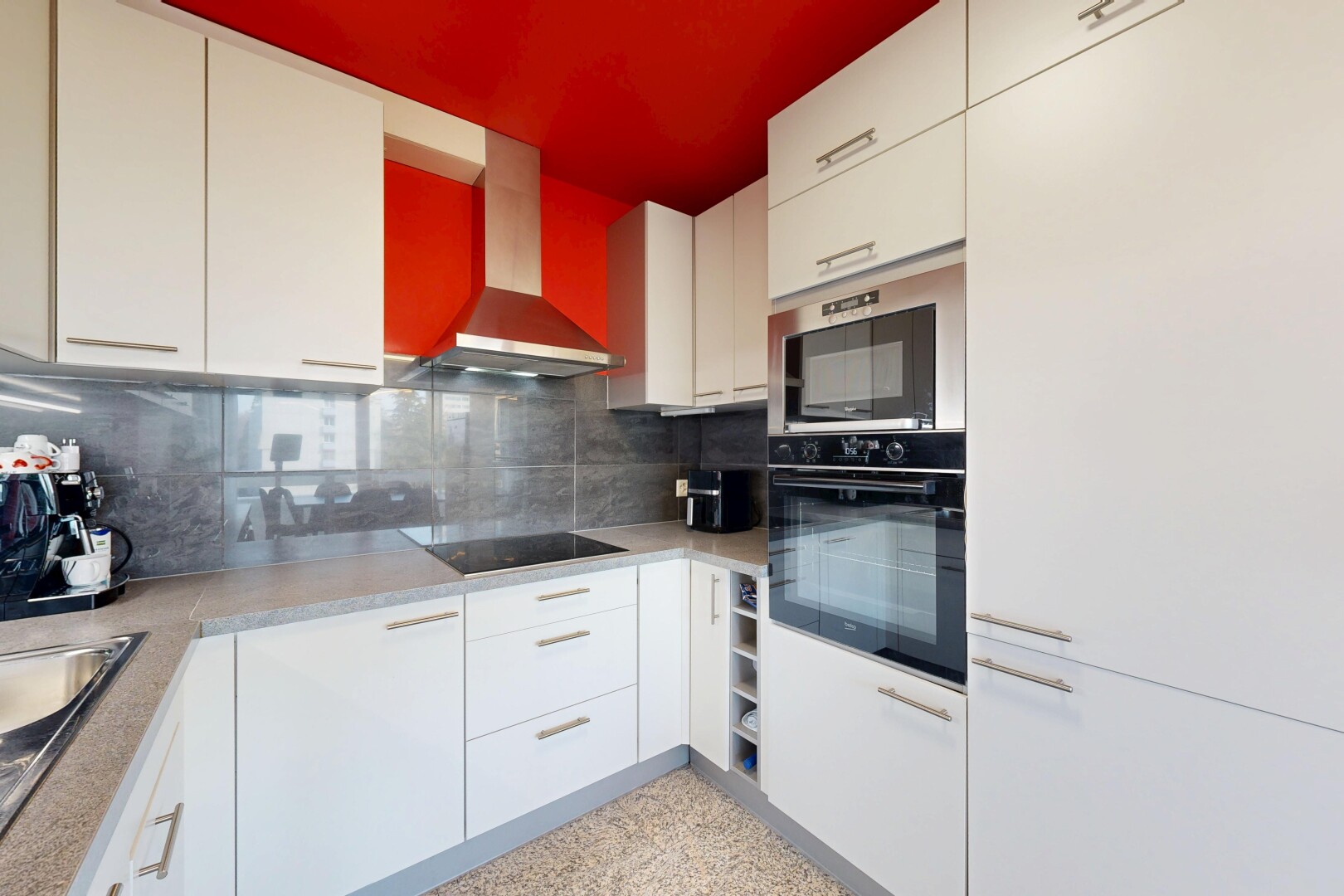 kitchen with decorative backsplash, white cabinetry, dark speckled floor, black electric stovetop, and stainless steel double oven