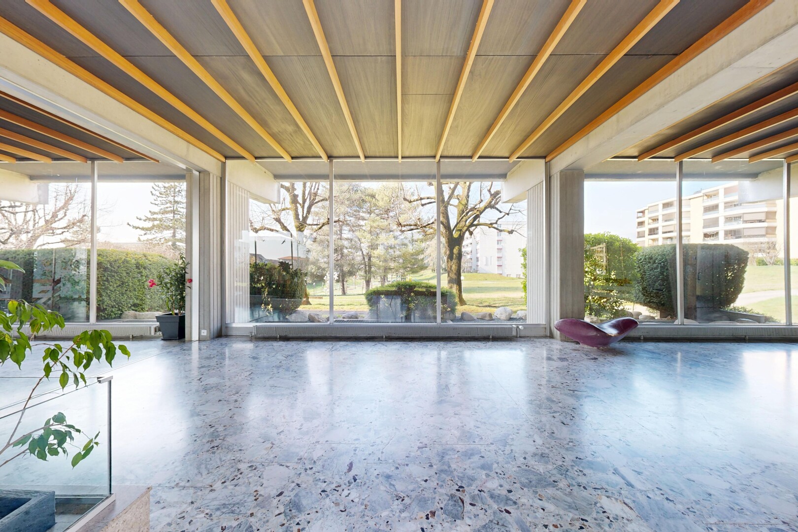 patio / terrace with a sunroom