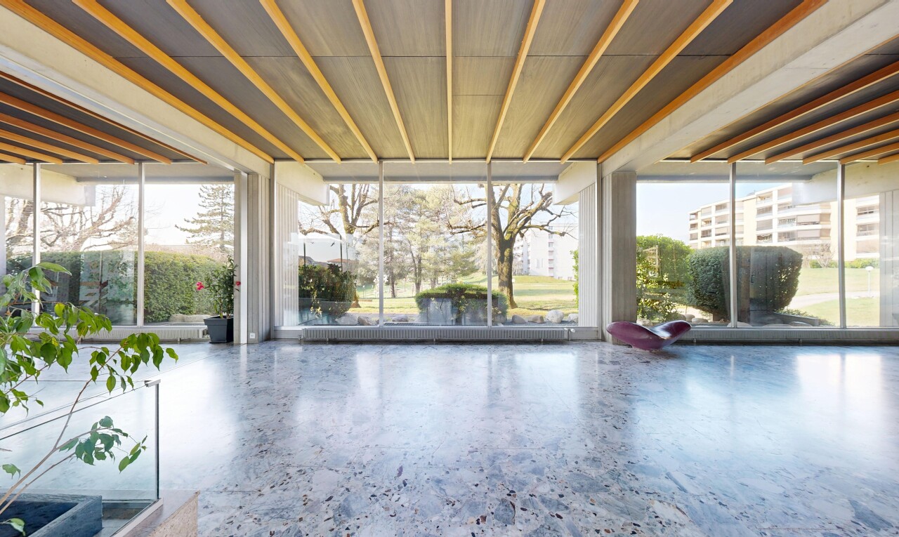 patio / terrace with a sunroom