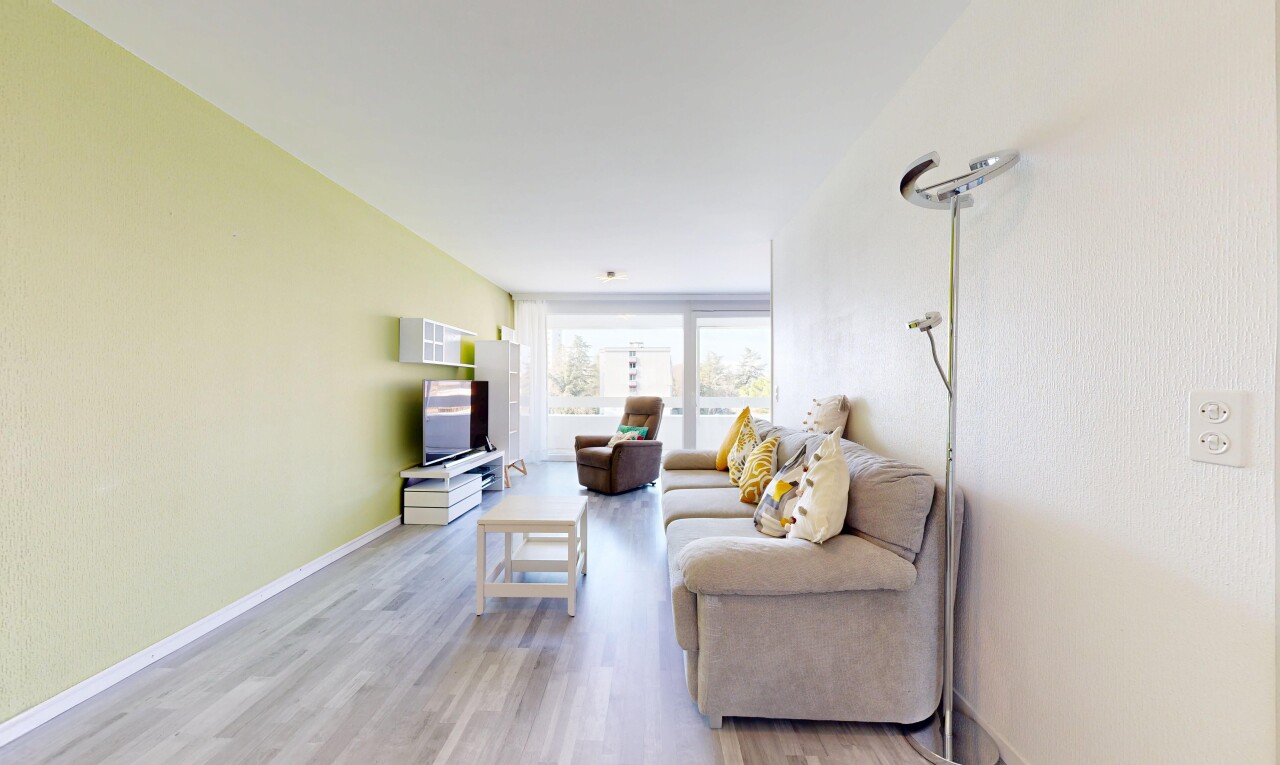 living room with light wood-style floors and baseboards