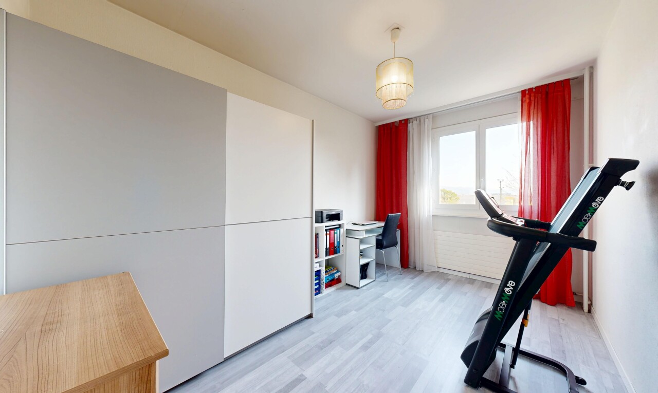 exercise room featuring light wood-type flooring