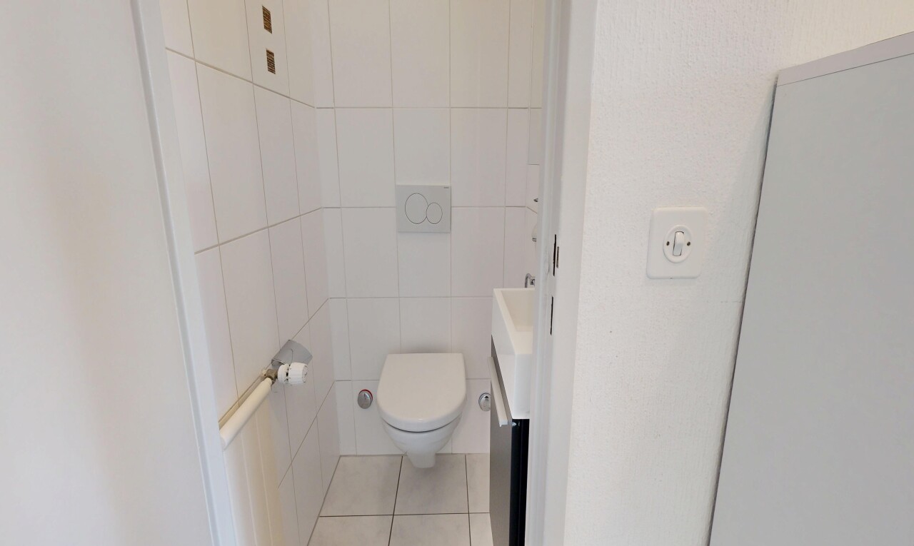 bathroom with vanity, tile walls, and light tile patterned floors