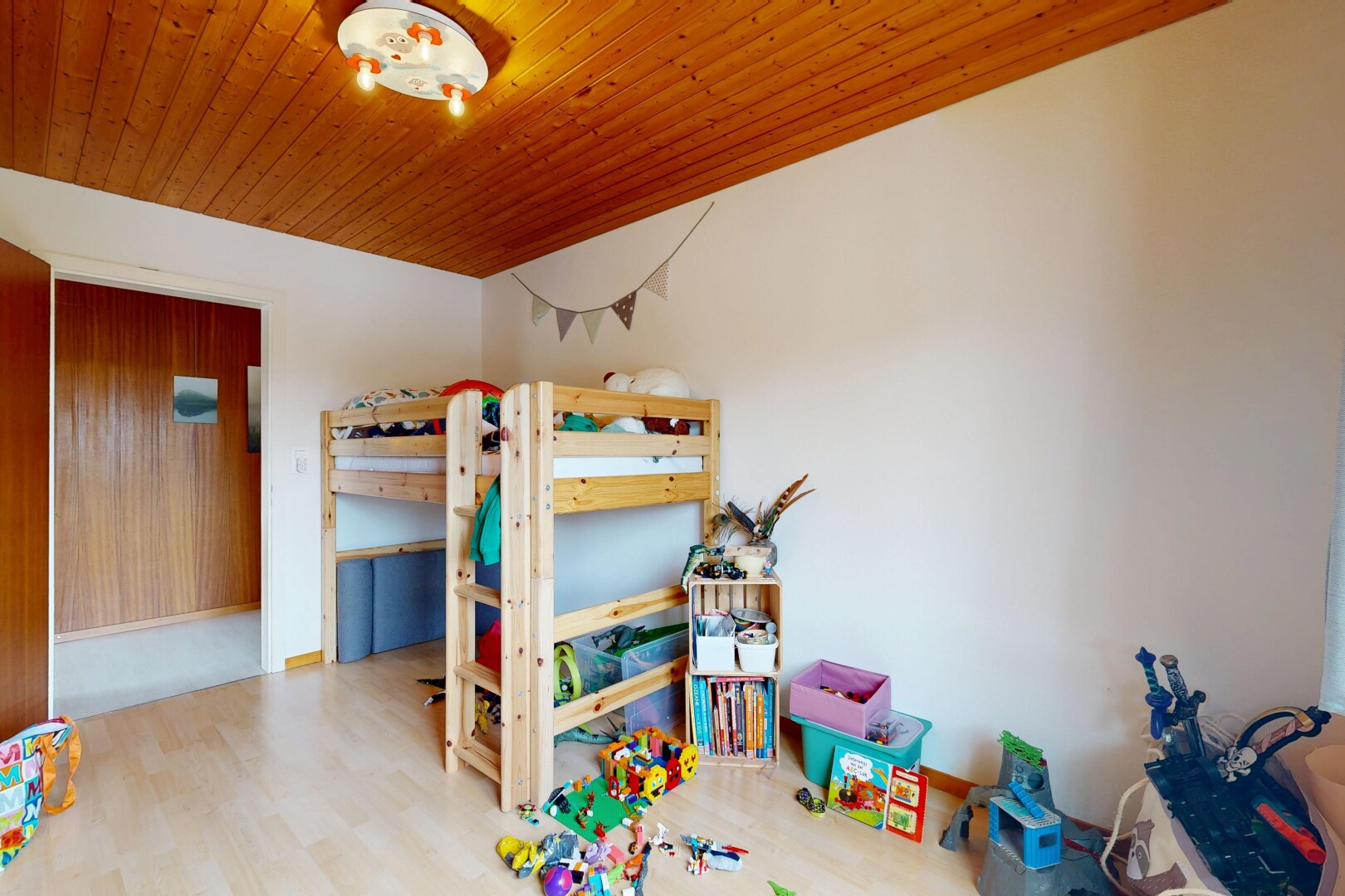 room with wood finished floors and wooden ceiling