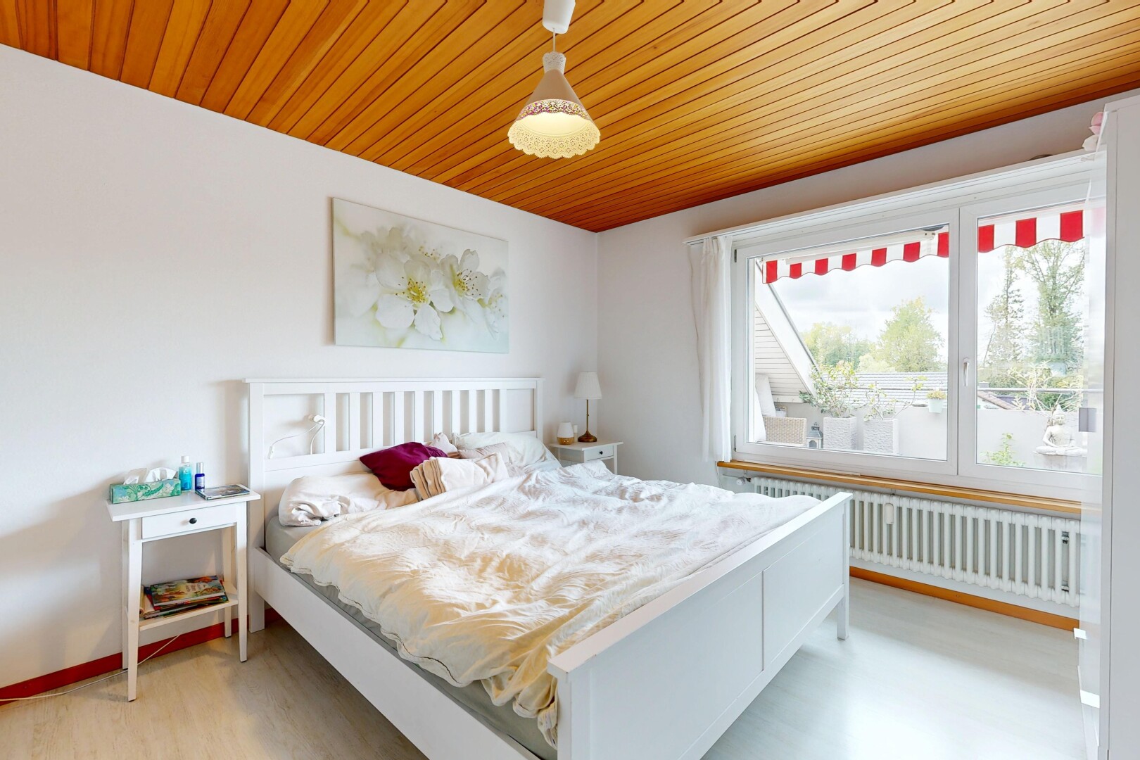 room featuring radiator, light wood finished floors, and wood ceiling